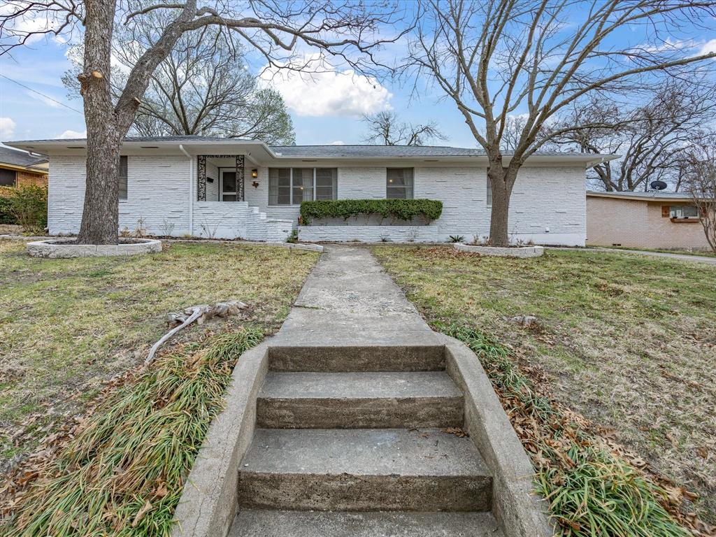 514 West Ridgewood Drive Garland, TX 75041 - Photo 4 of 39 a front view of house with yard and seating area
