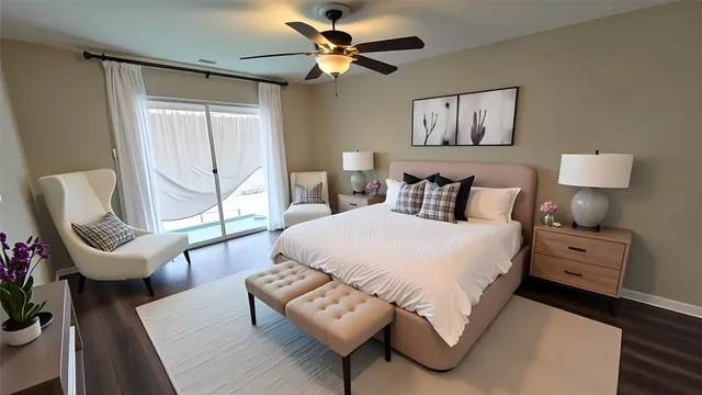 a bedroom with a bed chairs and window