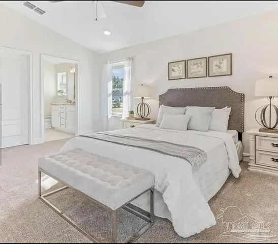 a bedroom with a bed and a dresser