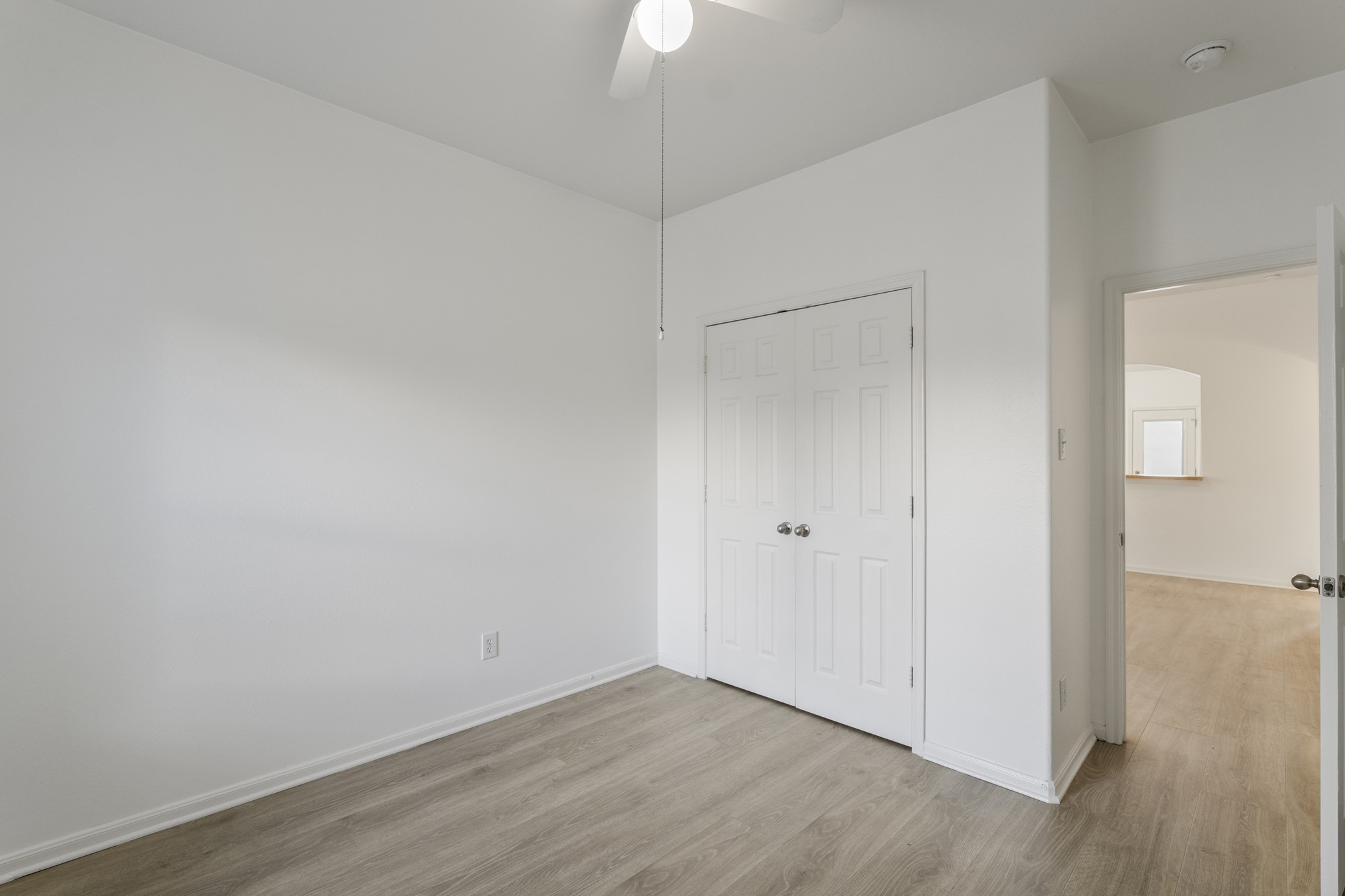 21810 Mansfield Bluff Lane Spring, TX 77379 - Photo 24 of 34 From this angle, the bedroom looks back toward the doorway that leads into the living area, giving a clear sense of how this room sits just off the main space.