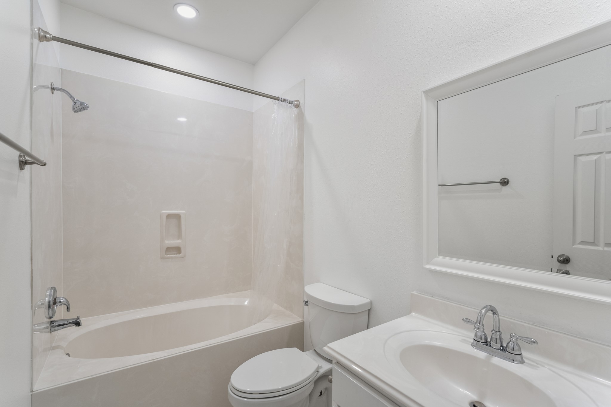 21810 Mansfield Bluff Lane Spring, TX 77379 - Photo 25 of 34 The secondary bathroom features a tub and shower combination with a vanity and storage below, positioned conveniently near the secondary bedrooms.