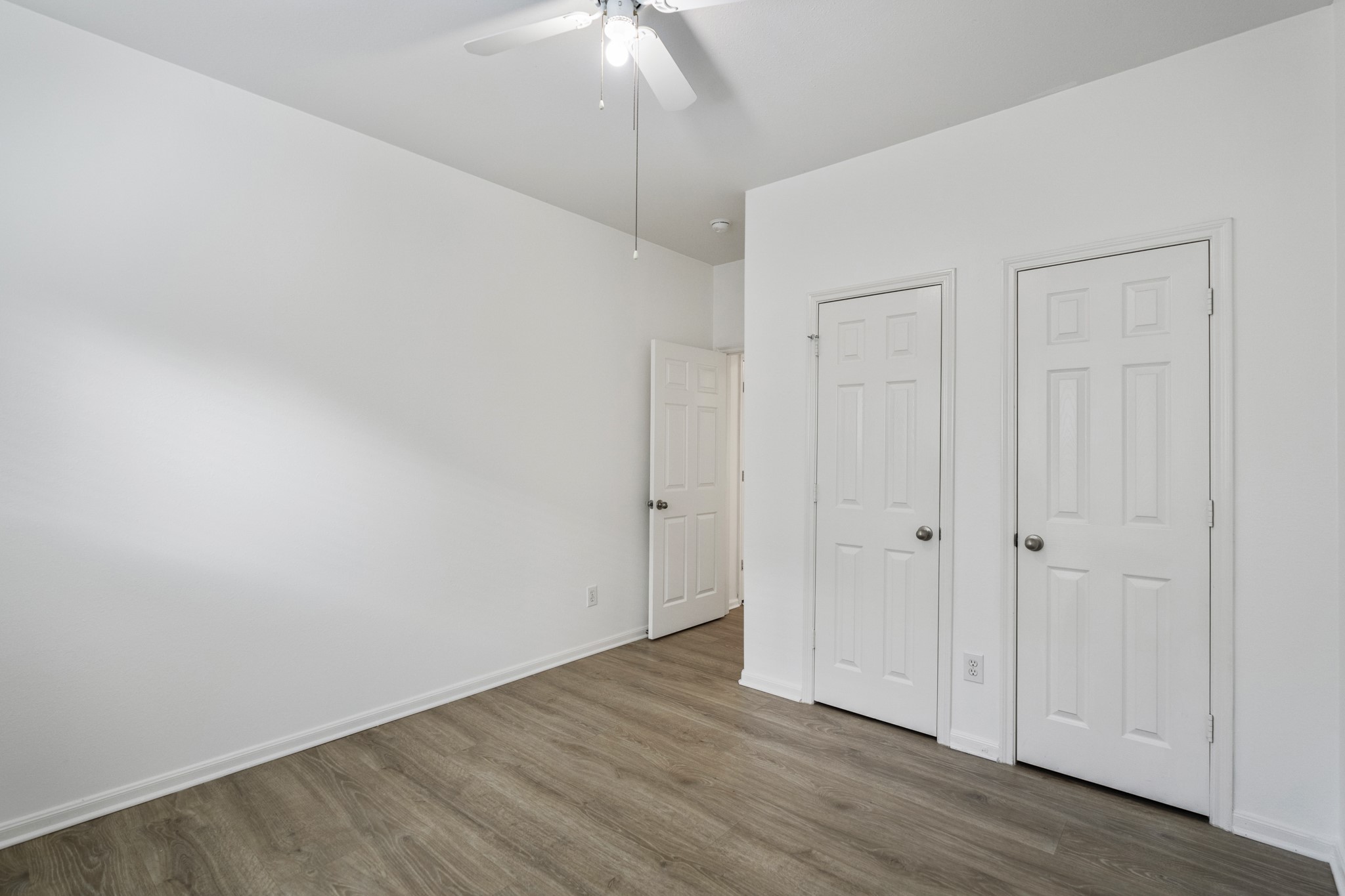 21810 Mansfield Bluff Lane Spring, TX 77379 - Photo 27 of 34 Another angle of the third bedroom shows the closet and entry, giving a better sense of the layout and how the room connects back to the hallway.