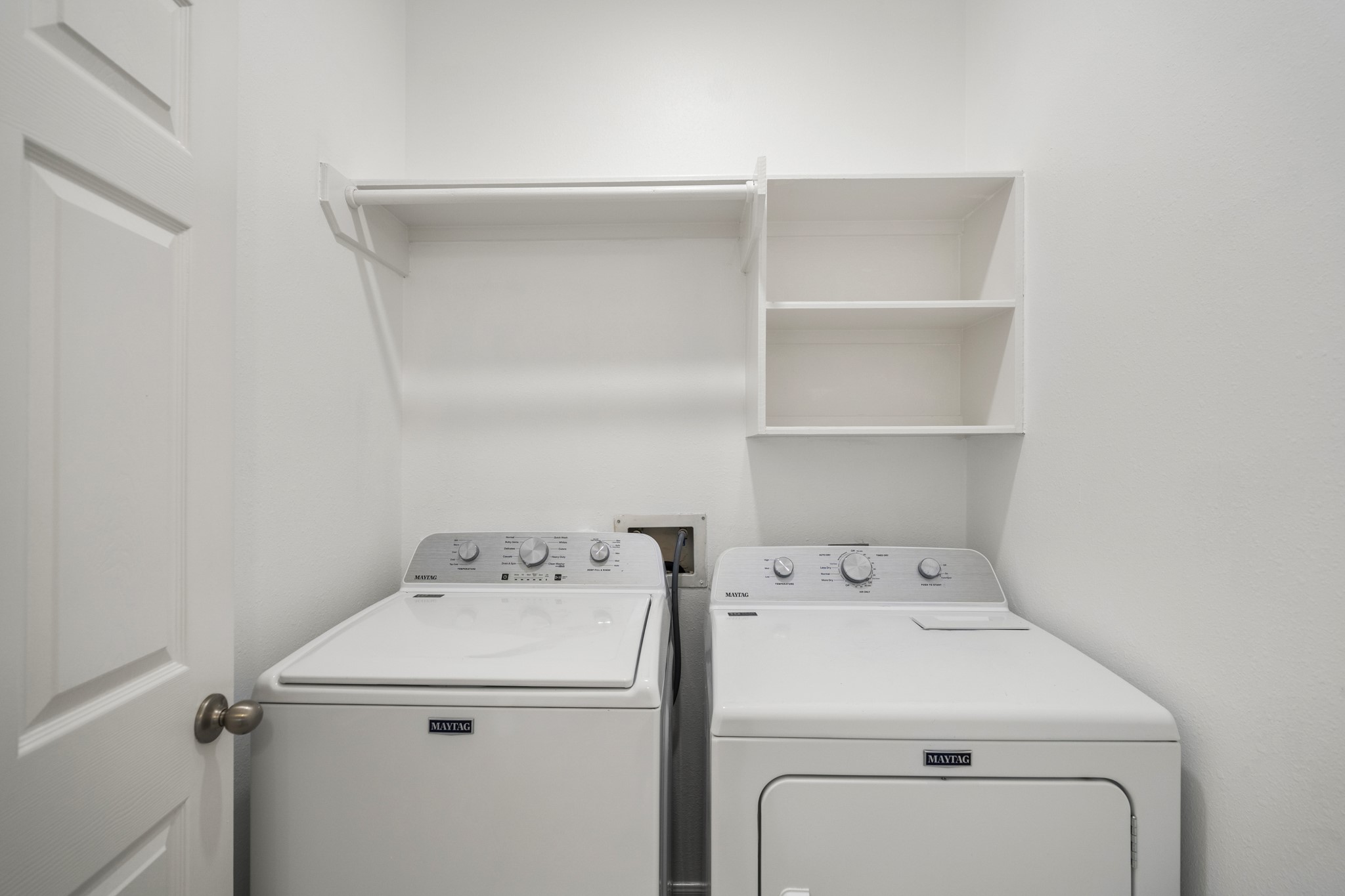 21810 Mansfield Bluff Lane Spring, TX 77379 - Photo 28 of 34 The laundry room is located just off the primary suite, with washer and dryer included and built-in shelving above for added storage and organization.