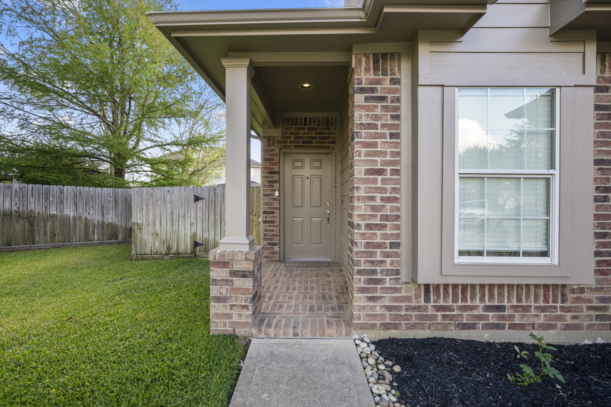 21810 Mansfield Bluff Lane Spring, TX 77379 - Photo 3 of 34 The covered front porch creates a welcoming entry, with space to step in out of the elements before heading inside.
