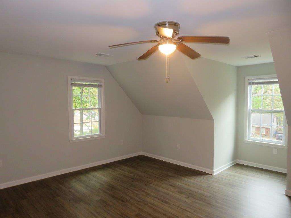 40 Lake Court Stockbridge, GA 30281 - Photo 13 of 24 a view of an empty room with wooden floor and window
