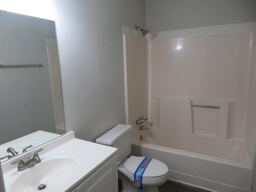 40 Lake Court Stockbridge, GA 30281 - Photo 16 of 24 a bathroom with a sink toilet and shower