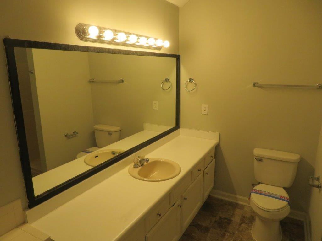 40 Lake Court Stockbridge, GA 30281 - Photo 22 of 24 a bathroom with a sink and mirror