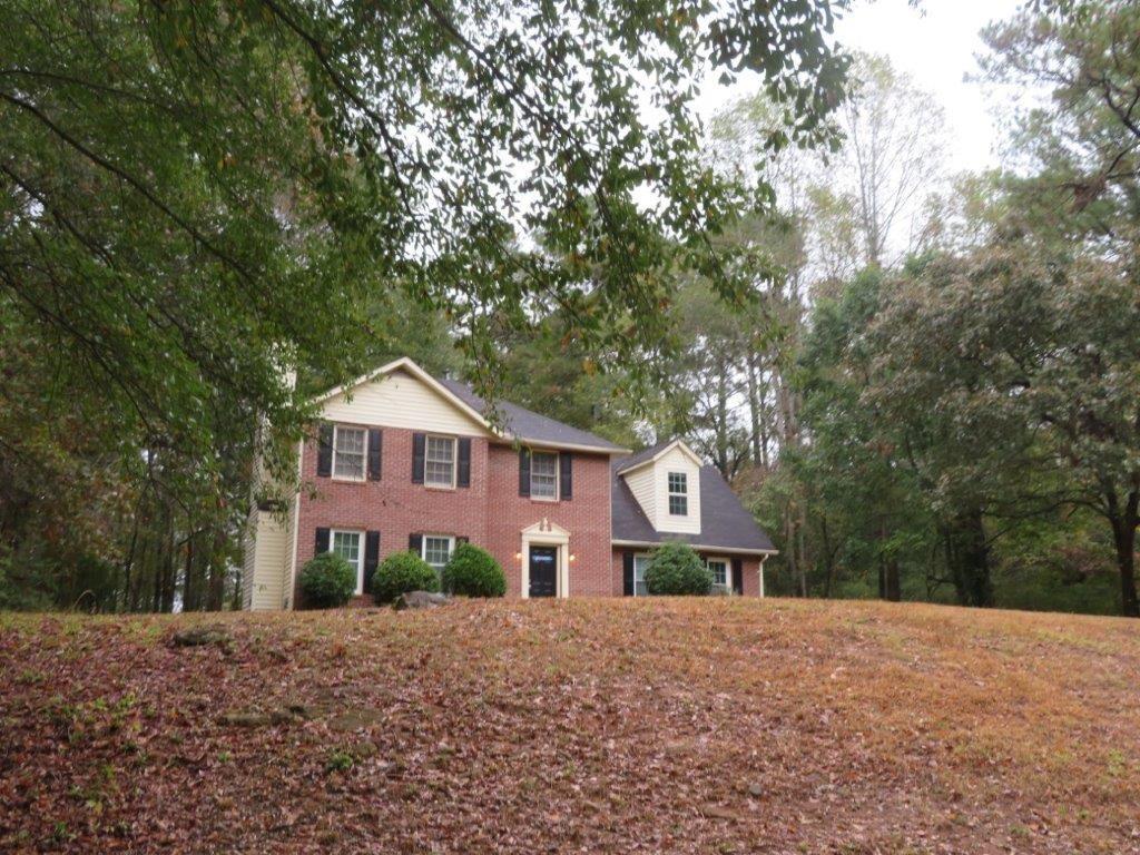 40 Lake Court Stockbridge, GA 30281 - Photo 24 of 24 a front view of a house with a yard and garage