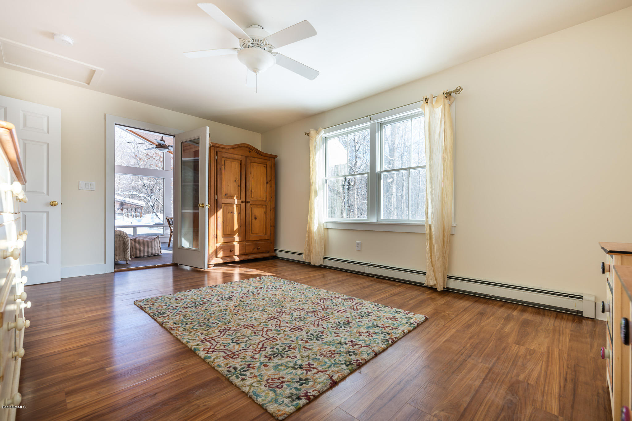 351 W Road Richmond, MA 01254 - Photo 14 of 46 an empty room with wooden floor and windows