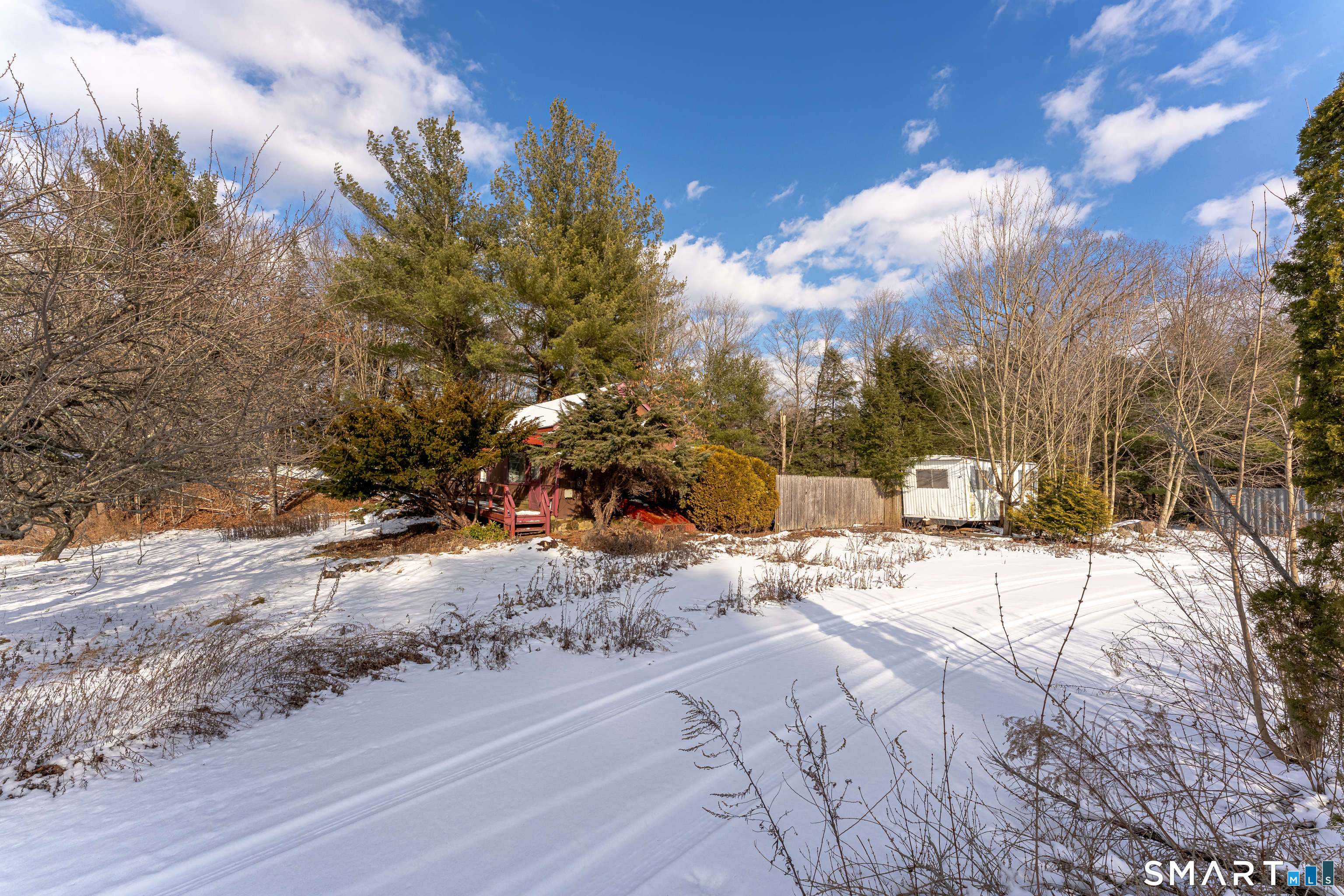 263-271 South Main Street Newtown, CT 06470 - Photo 14 of 24 a view of a yard with snow on the road