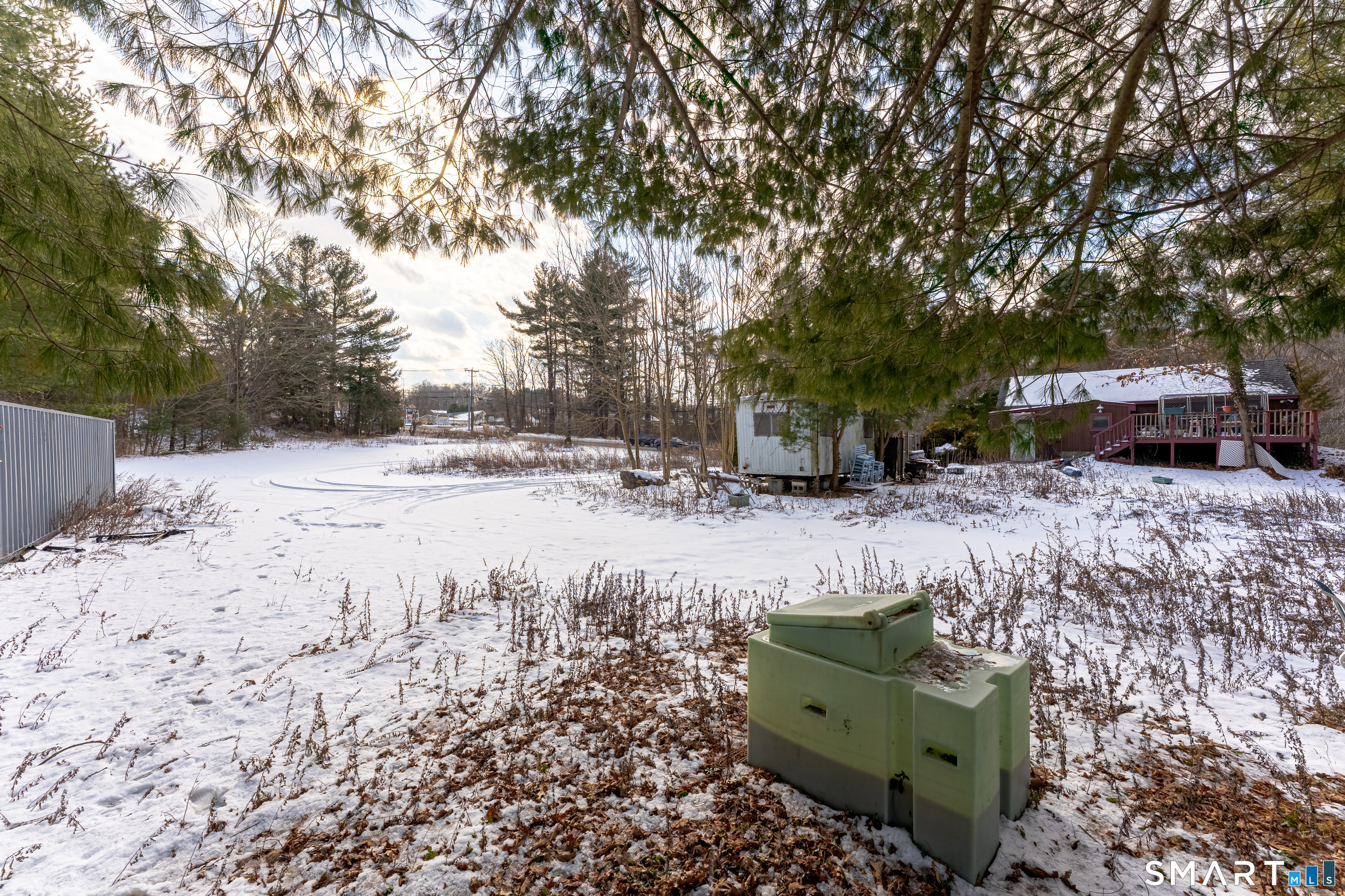 263-271 South Main Street Newtown, CT 06470 - Photo 17 of 24 a view of a yard with a house