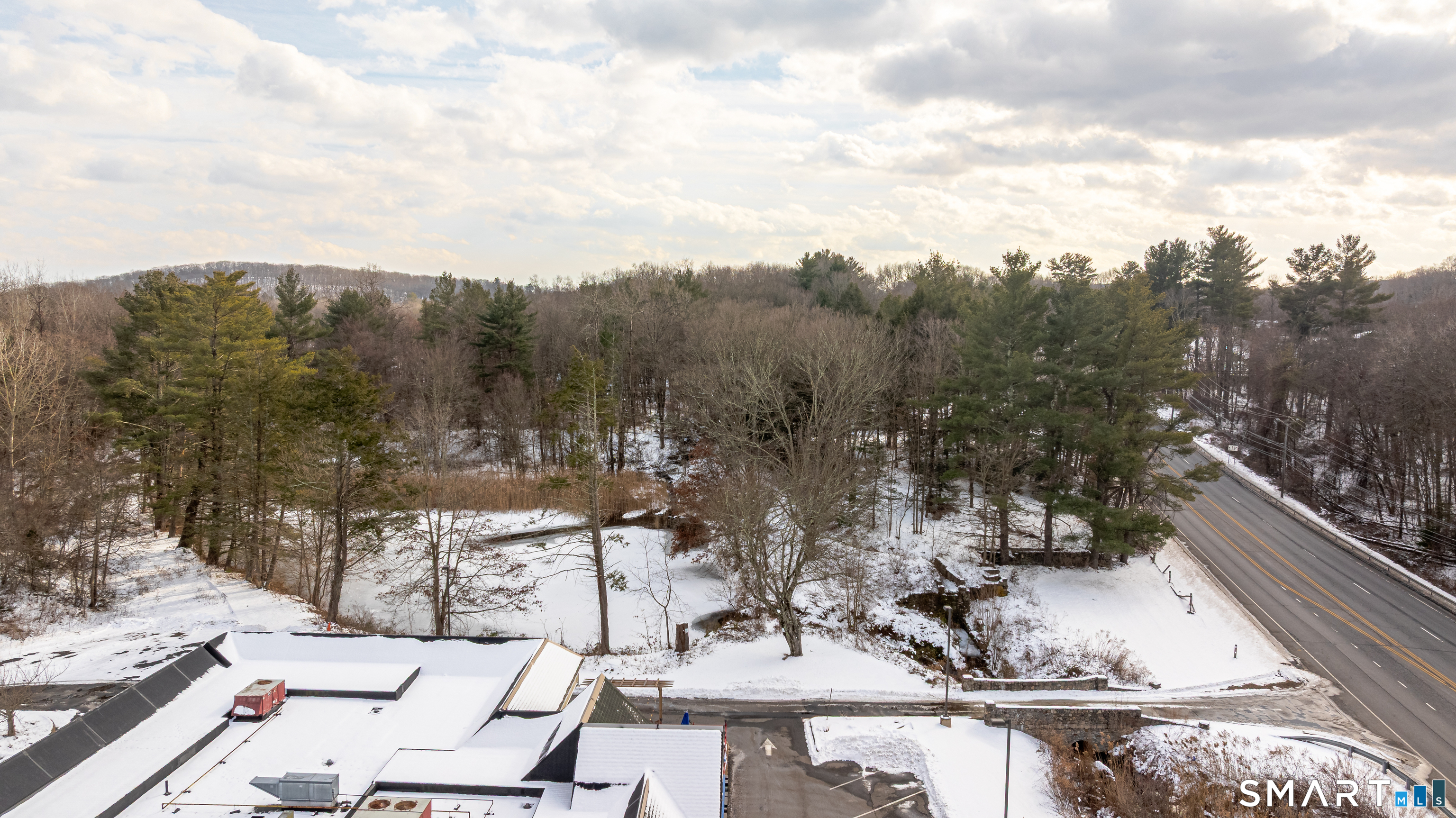 263-271 South Main Street Newtown, CT 06470 - Photo 23 of 24 a view of a lake with a mountain