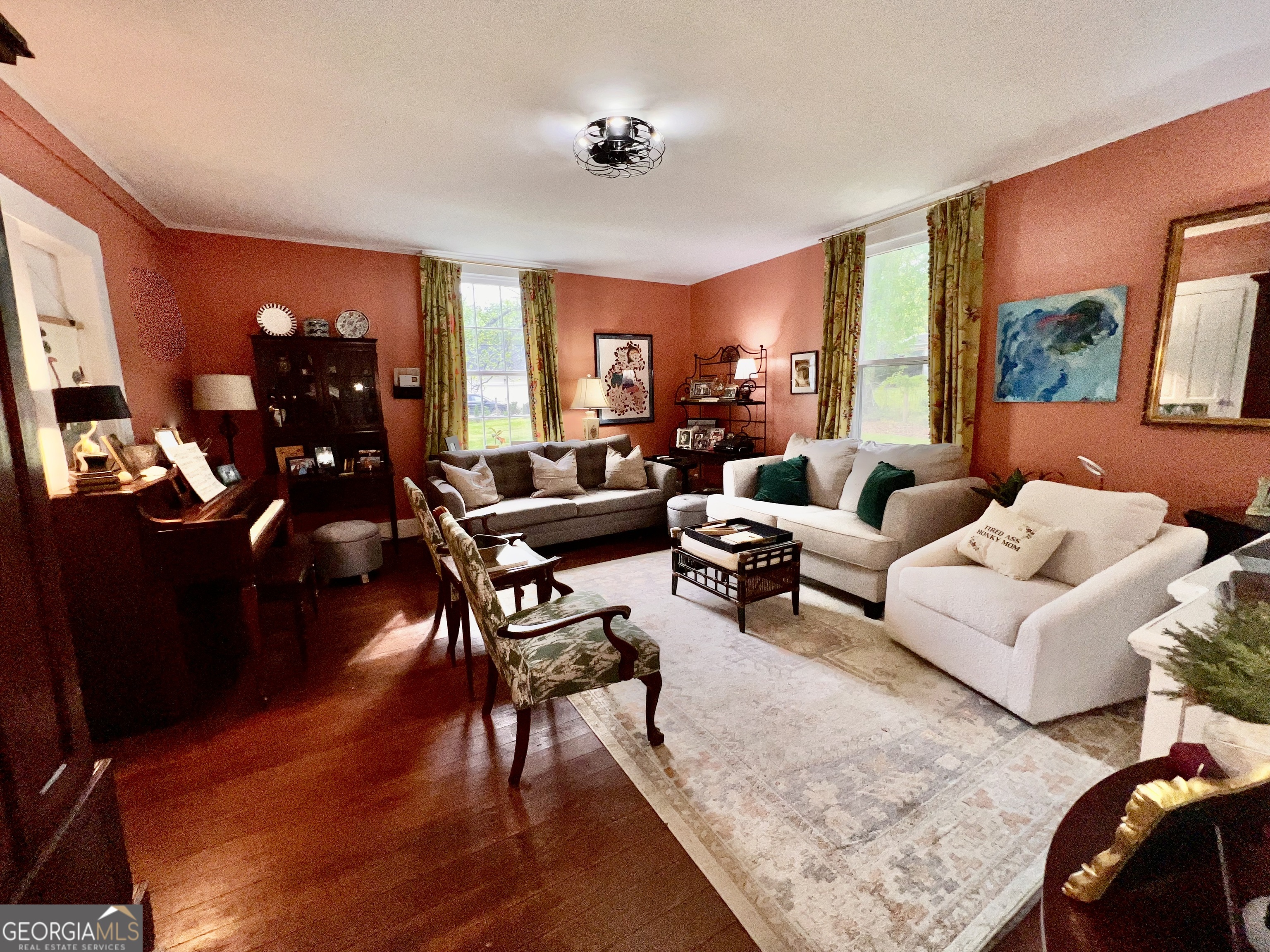 600 Foster Street Madison, GA 30650 - Photo 15 of 54 a living room with furniture and wooden floor