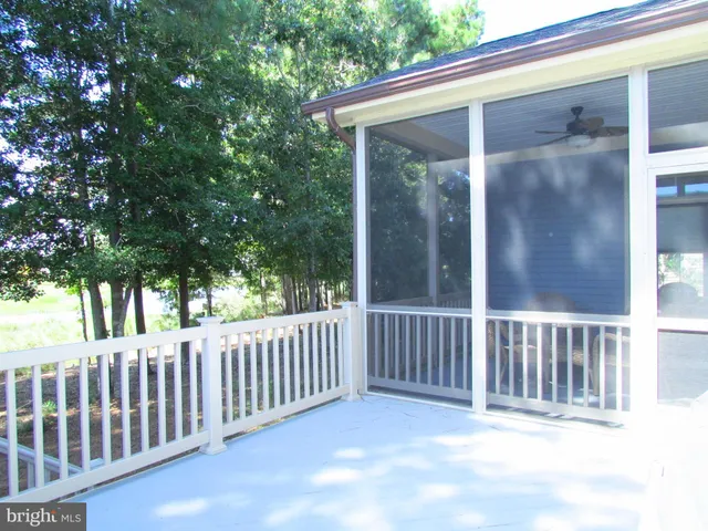a view of a porch with a small yard