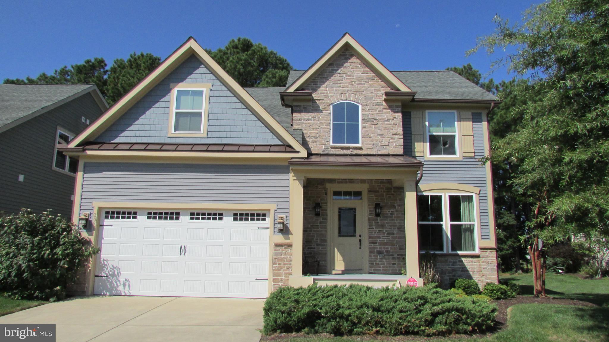 30671 Kingbird Court Ocean View, DE 19970 - Photo 4 of 21 a front view of a house with a yard