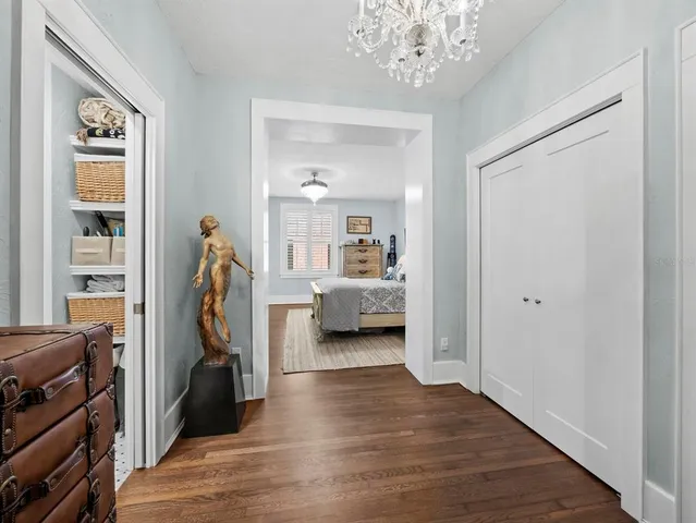 a view of a bedroom with furniture and staircase