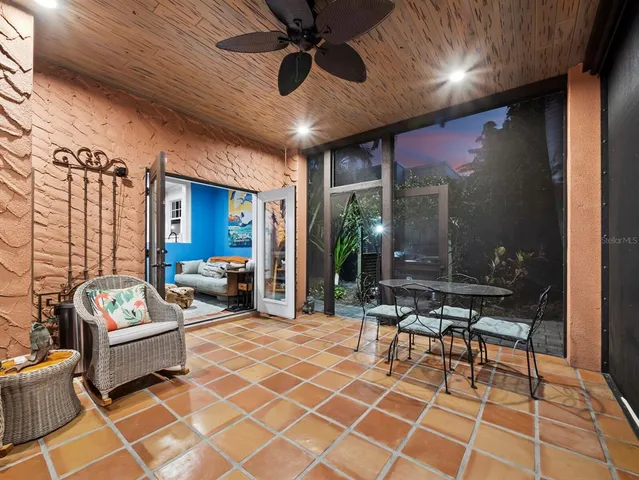 a outdoor space with patio furniture and a chandelier