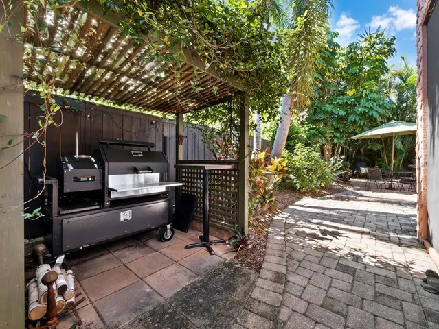 a view of a backyard with sitting area