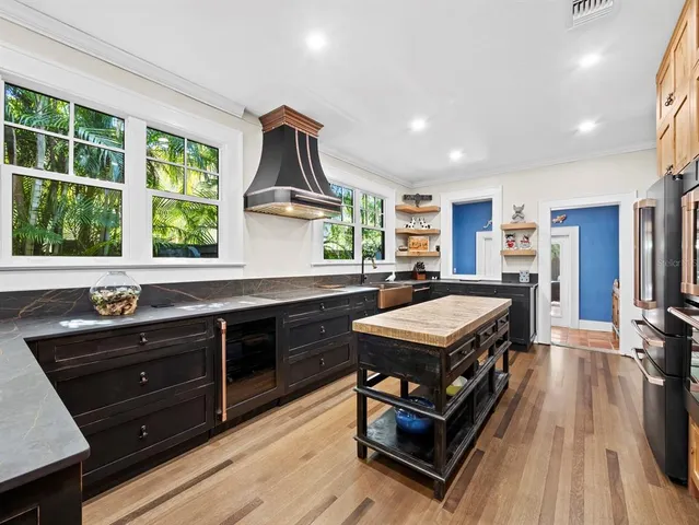 a living room with a flat screen tv and a large window