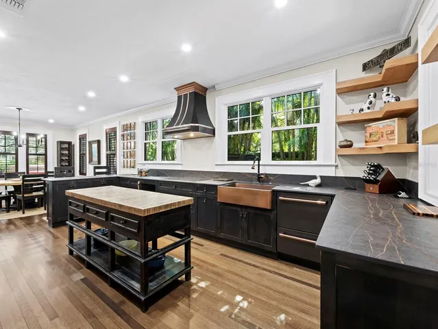 a kitchen with a stove a sink and a refrigerator