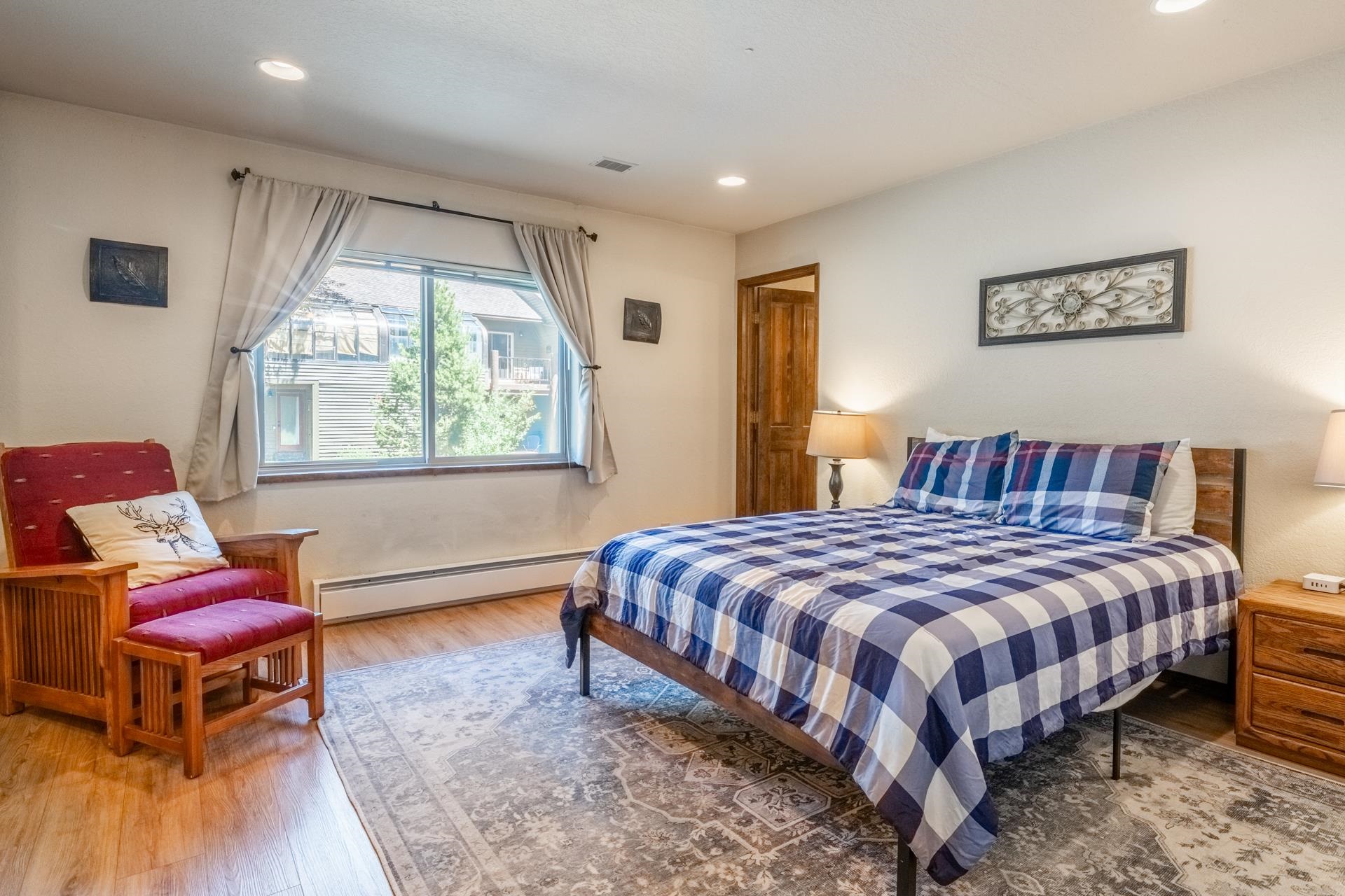 384 Joaquin Road, Unit 36 Mammoth Lakes, CA 93546 - Photo 23 of 36 Spacious bedroom featuring wood-finish flooring, recessed lighting, and a large window