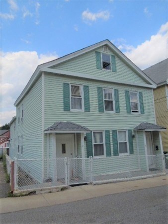 8-10 Cady Street Lowell, MA 01852 - Photo 1 of 11 a front view of a house with a yard