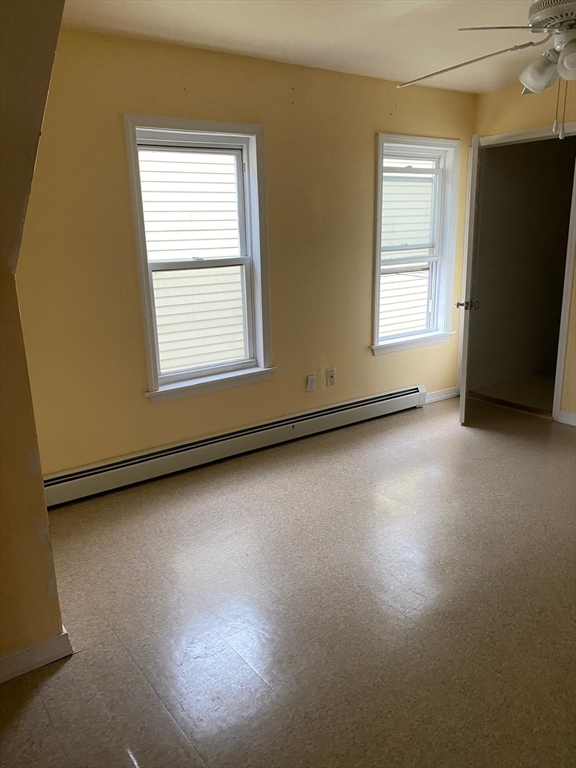 8-10 Cady Street Lowell, MA 01852 - Photo 11 of 11 a view of a livingroom with wooden floor and a window