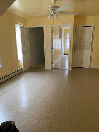 an empty room with a bathroom