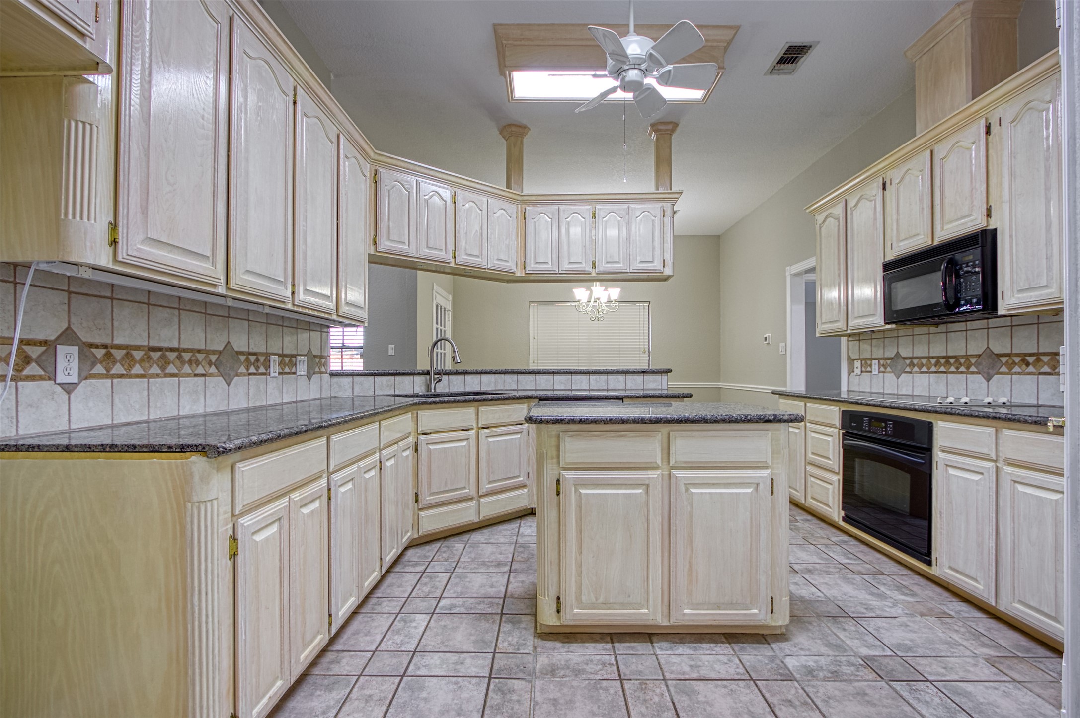 9 North Cay Angleton, TX 77515 - Photo 11 of 30 a kitchen with a stove cabinets and a microwave
