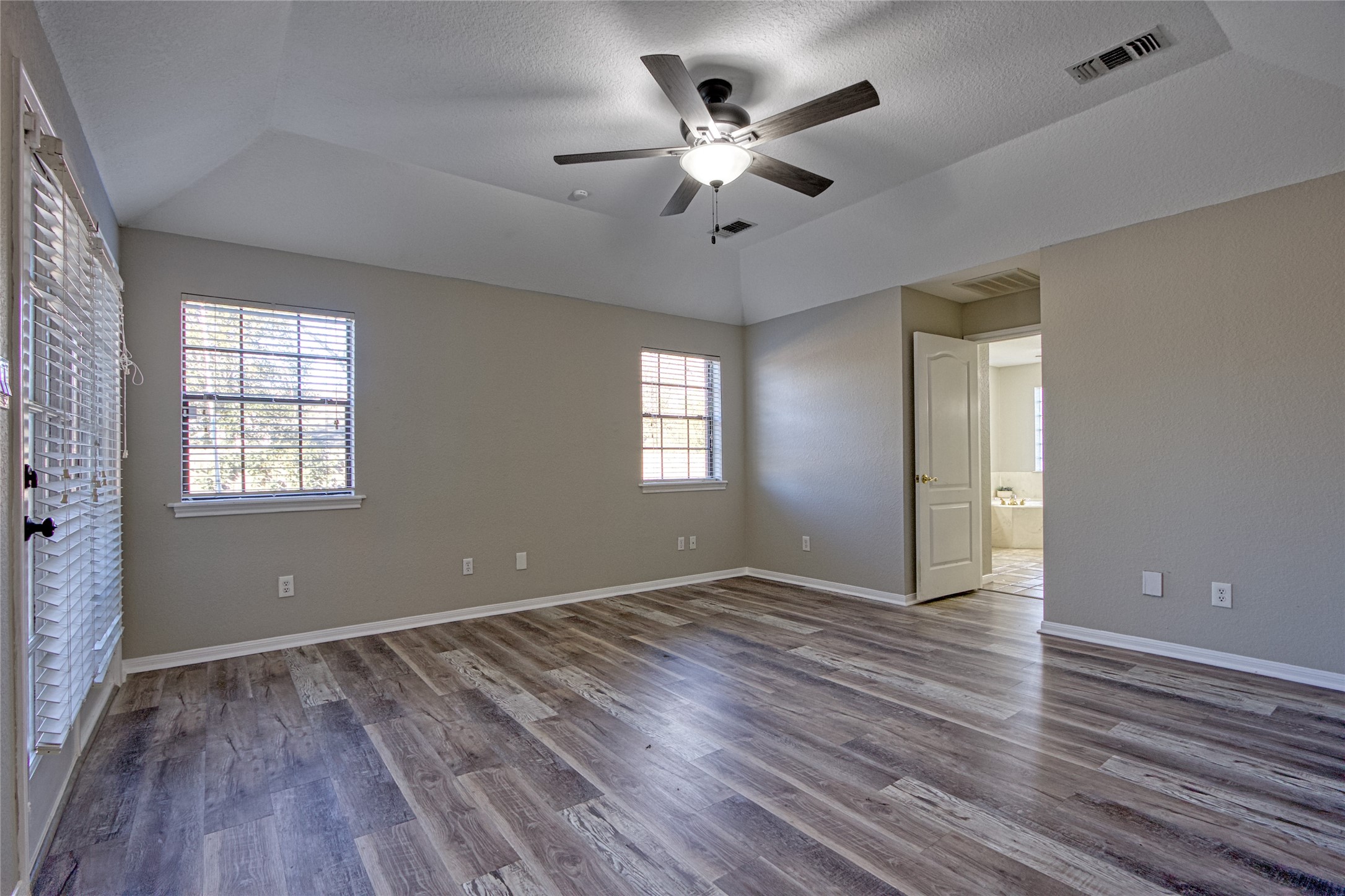 9 North Cay Angleton, TX 77515 - Photo 15 of 30 wooden floor in an empty room with a window