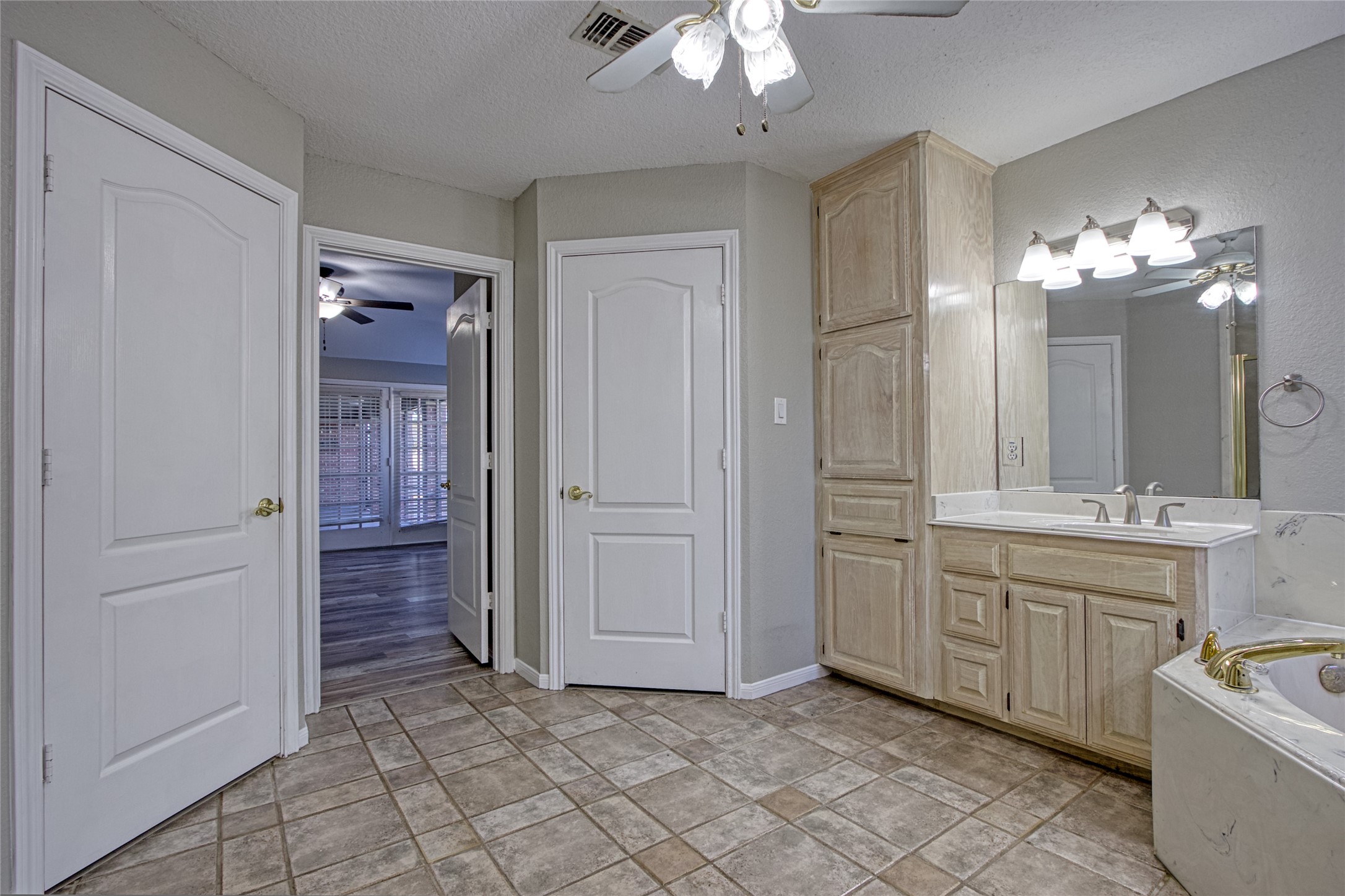 9 North Cay Angleton, TX 77515 - Photo 18 of 30 a spacious bathroom with a mirror a sink and a shower