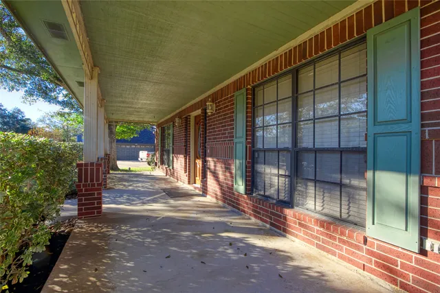 a view of backyard with porch