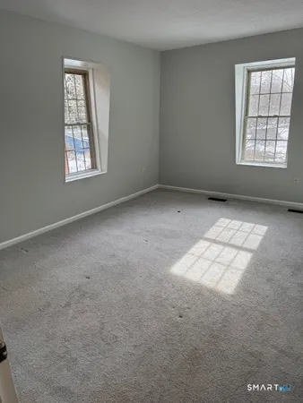 an empty room with windows