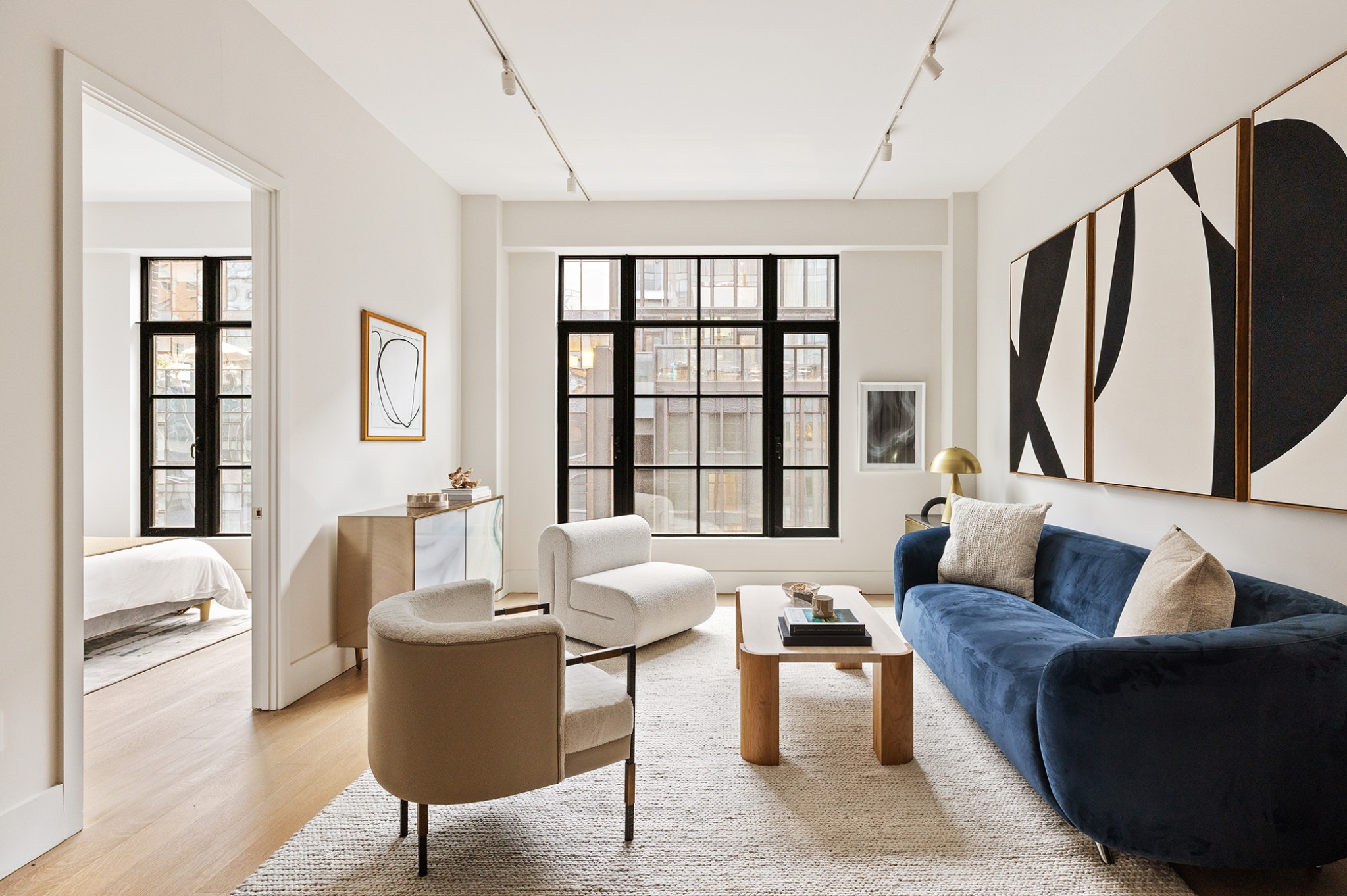 517 West 29th Street, Unit 6A Manhattan, NY 10001 - Photo 2 of 15 a living room with furniture and a large window