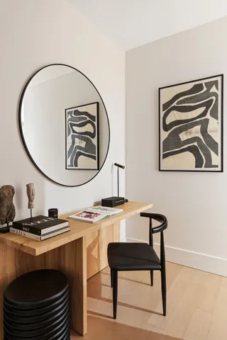 a room with a table chairs and a stove