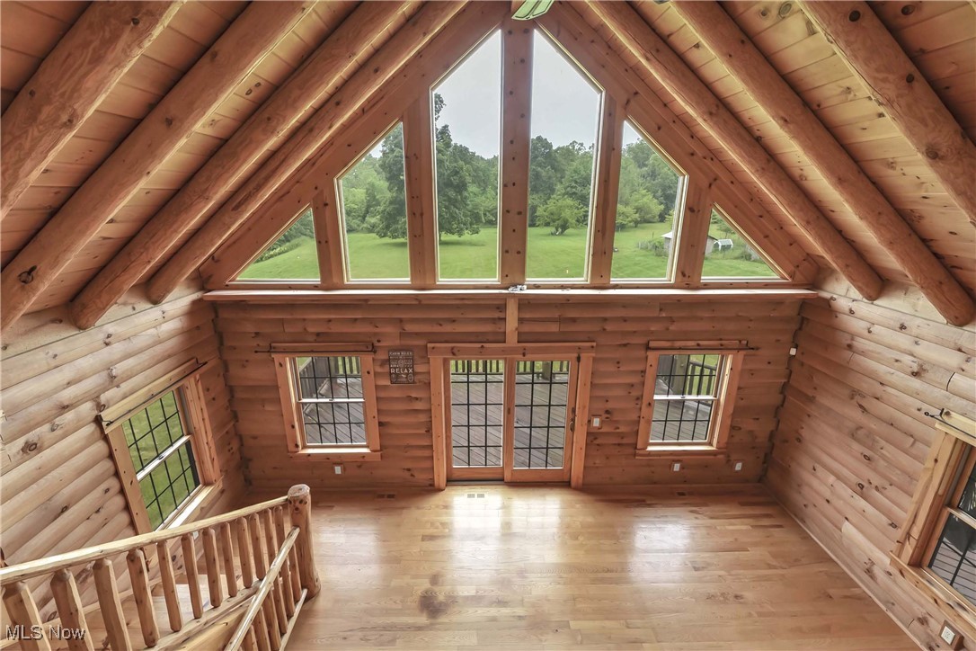 8164 Vandemark Road Lodi, OH 44254 - Photo 30 of 50 View from the second floor loft overlooking the great room and windows looking out over the back of the property