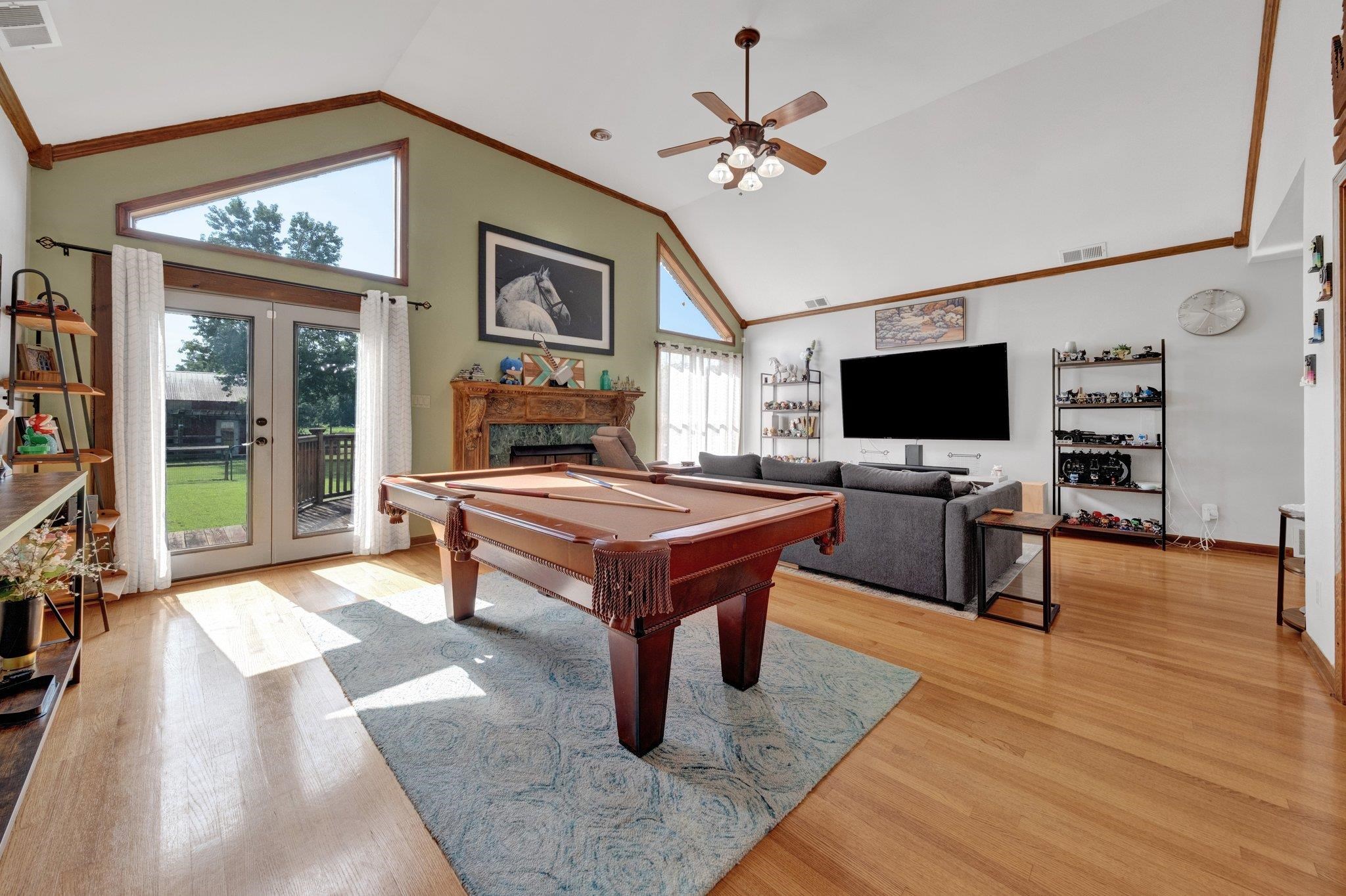 2710 Roland Road Memphis, TN 38002 - Photo 3 of 34 Rec room with vaulted ceiling, pool table, light wood-style floors, french doors, and a ceiling fan
