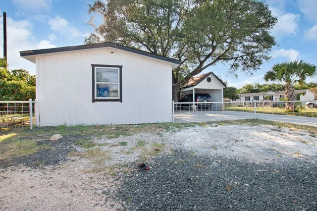 a house with trees in the background