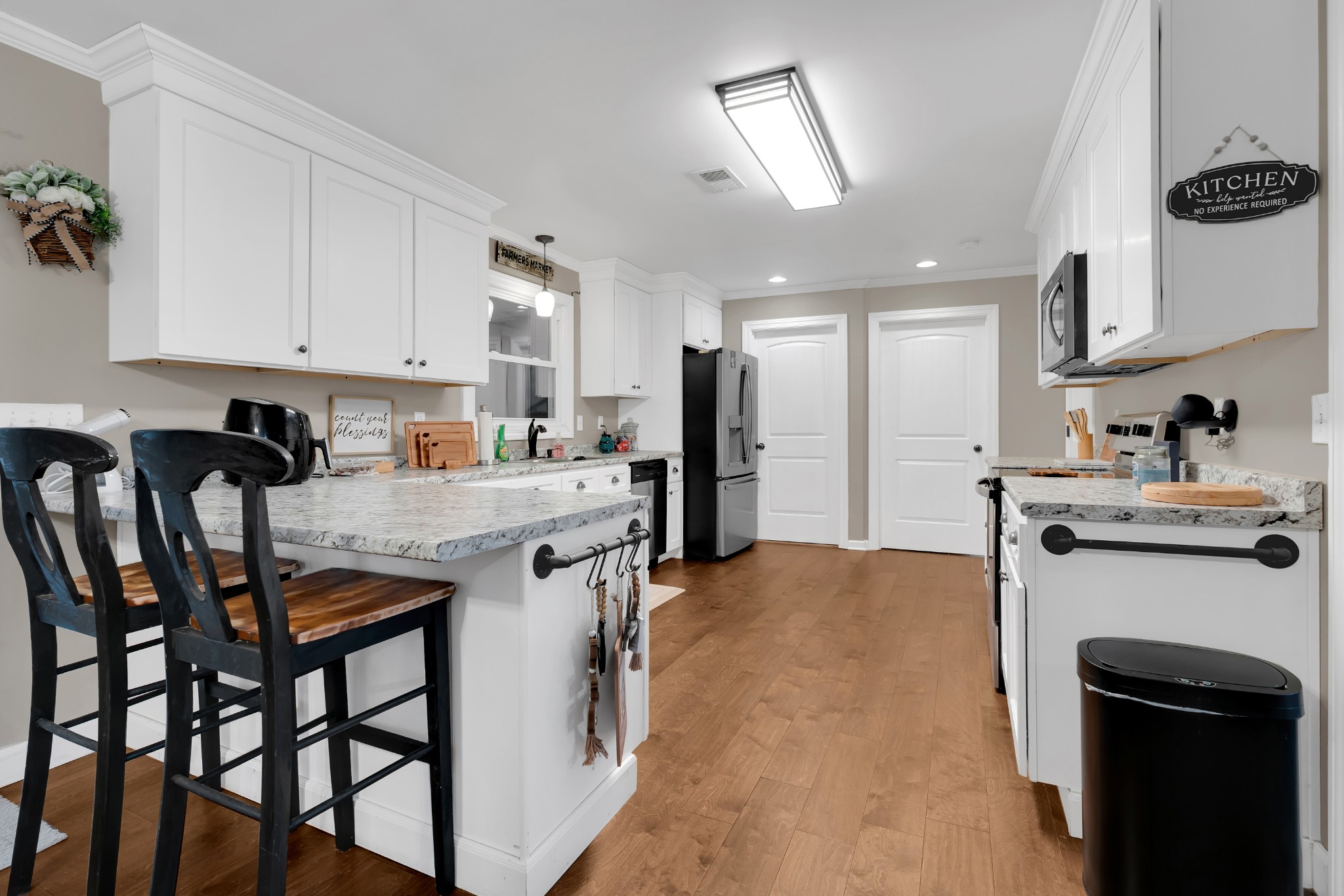 3197 Matts Hollow Road Manchester, TN 37355 - Photo 15 of 54 a kitchen with stainless steel appliances granite countertop a stove refrigerator and sink