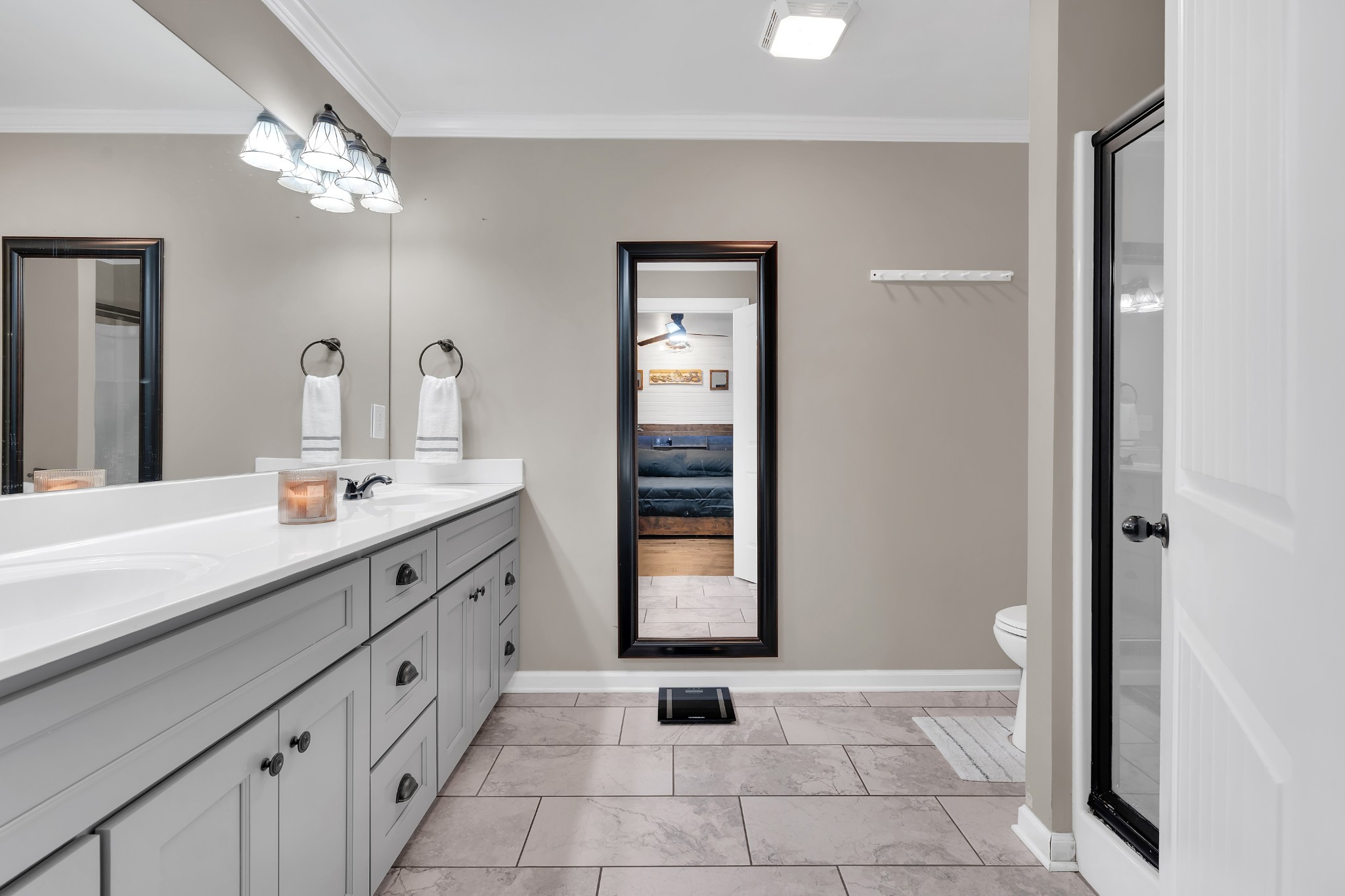 3197 Matts Hollow Road Manchester, TN 37355 - Photo 25 of 54 a spacious bathroom with a double vanity sink a mirror and a bathtub