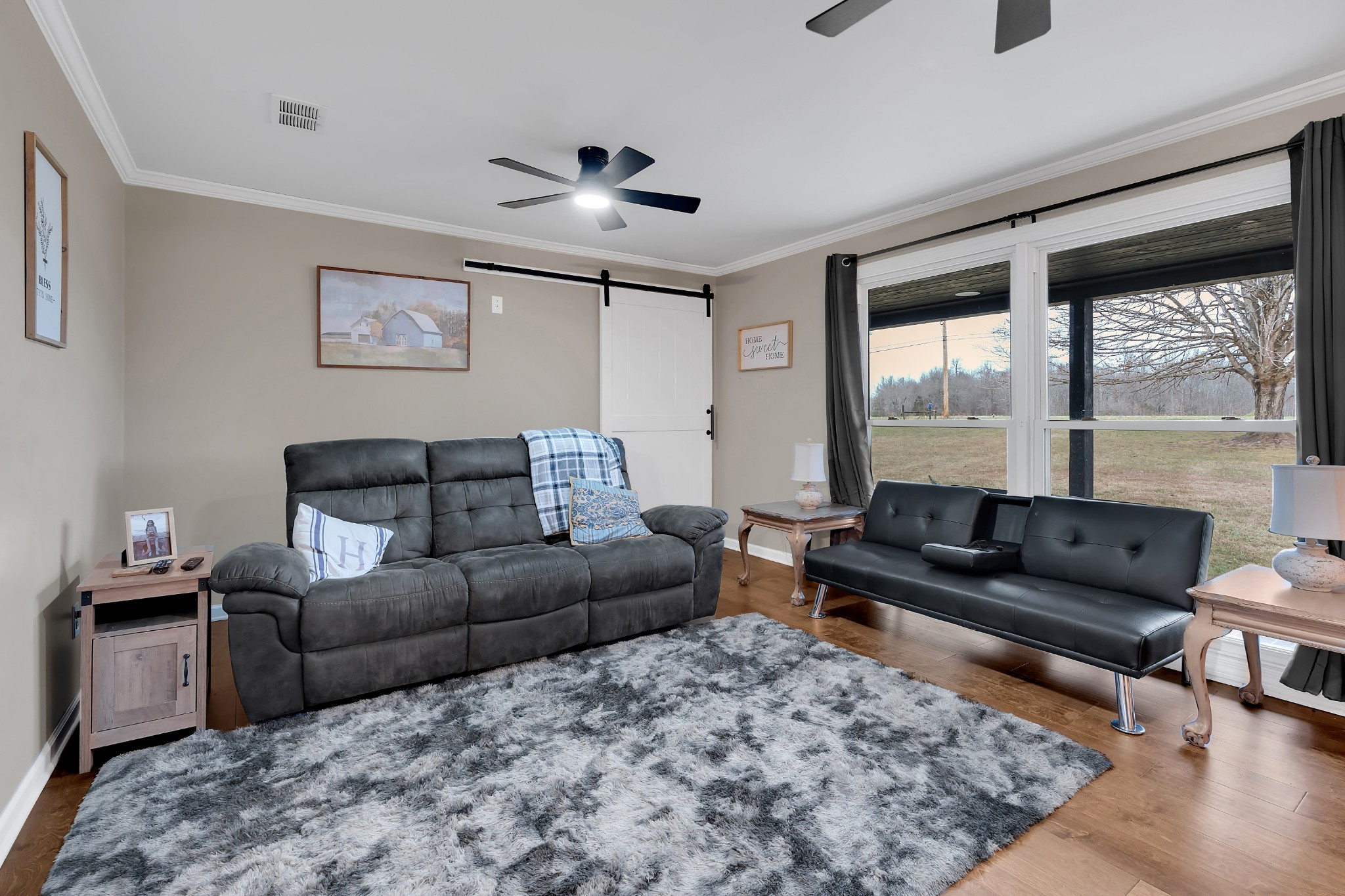 3197 Matts Hollow Road Manchester, TN 37355 - Photo 8 of 54 a living room with furniture and a large window