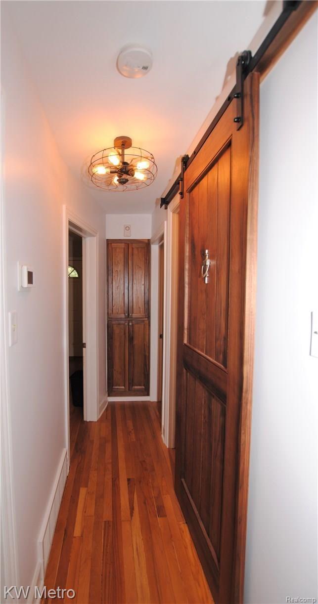 750 Columbia Road Berkley, MI 48072 - Photo 8 of 20 CUSTOM LINEN CABINET DOORS AND SLIDING DOOR TO 2ND FLOOR