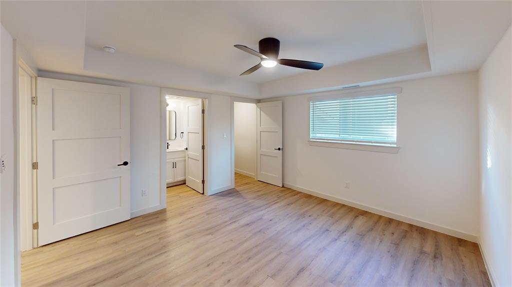 715 North Lancaster Avenue, Unit 210 Dallas, TX 75203 - Photo 4 of 22 a view of an empty room with wooden floor and a window