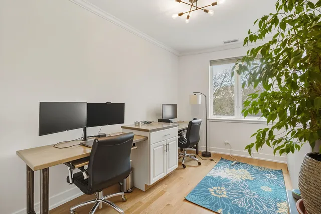 a view of a workspace with furniture