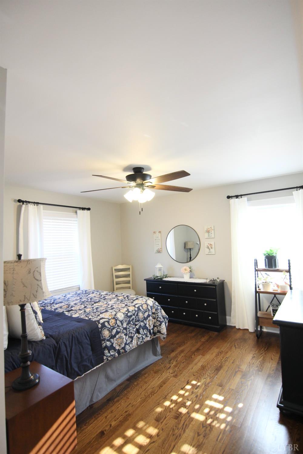 609 Midvale Street Lynchburg, VA 24502 - Photo 14 of 18 a bedroom with a bed and window
