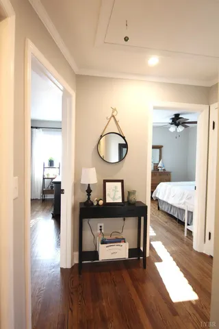 a bedroom with furniture and a mirror