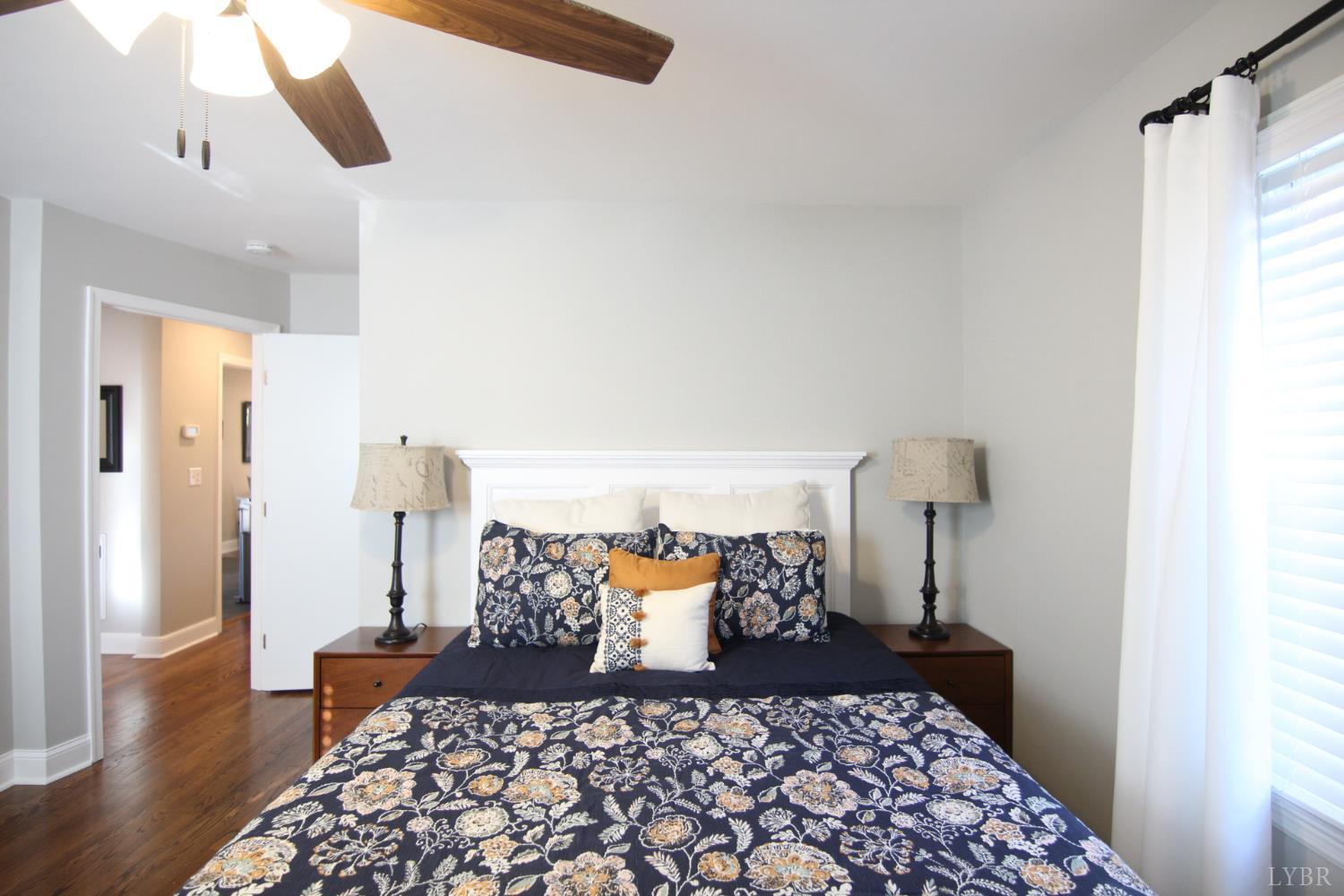 609 Midvale Street Lynchburg, VA 24502 - Photo 8 of 18 a bed room with furniture and a wooden floor