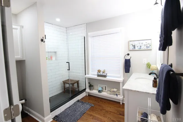 a view of a bedroom with furniture and flat screen tv