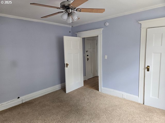 2083 Northwest Johnson Street, Unit 5 Portland, OR 97209 - Photo 11 of 15 an empty room with chandelier fan