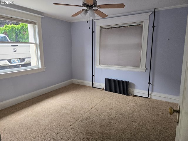 2083 Northwest Johnson Street, Unit 5 Portland, OR 97209 - Photo 12 of 15 an empty room with a fireplace and windows